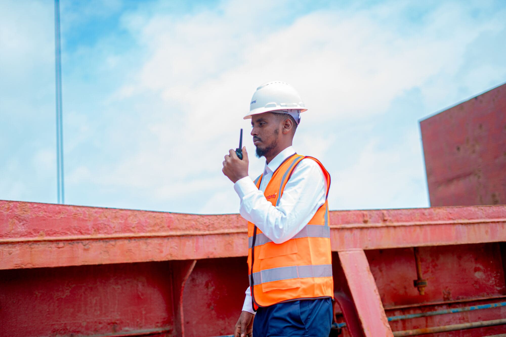 Accenti coordinator on a vessel deck using a radio