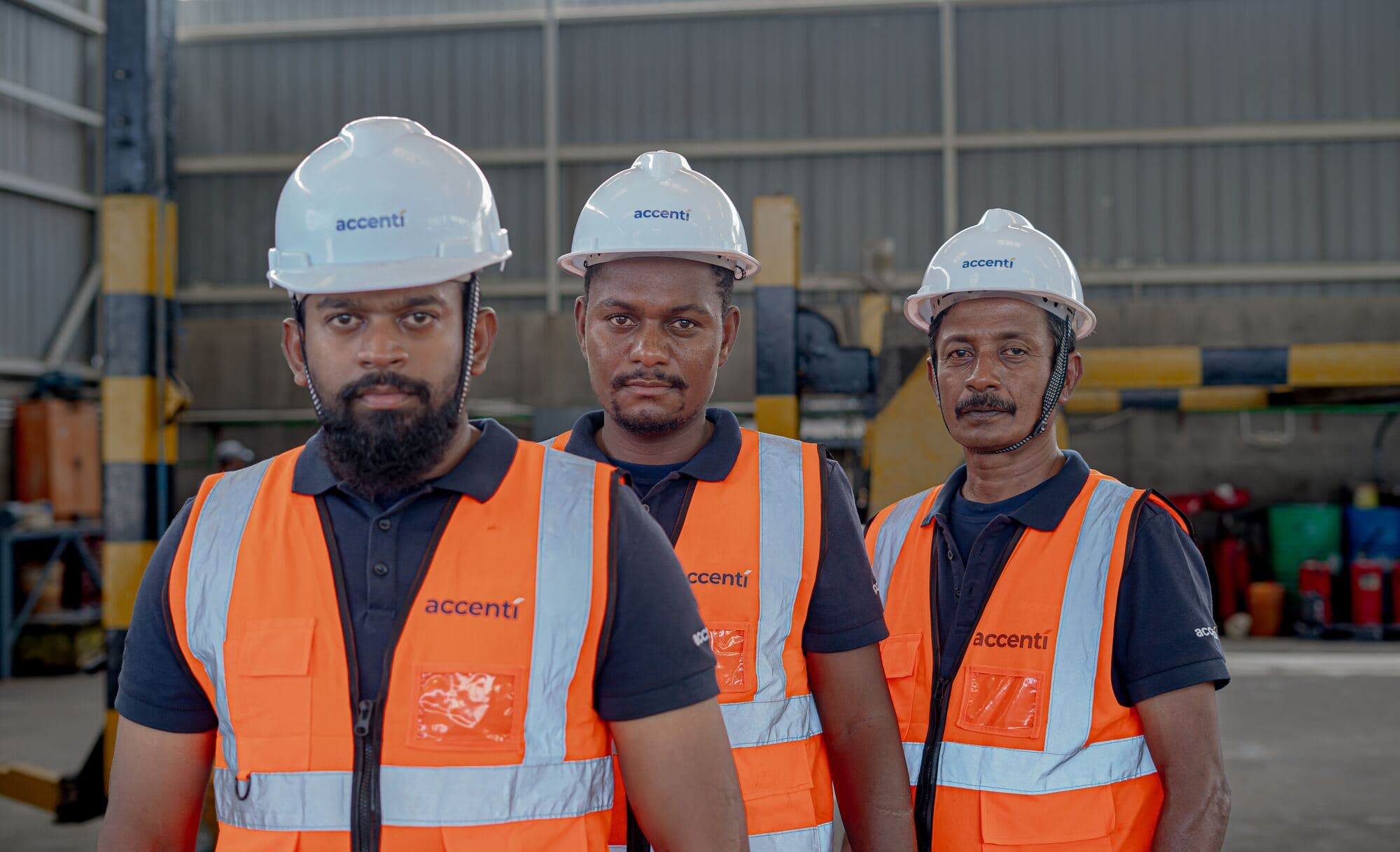 Accenti drivers and operators in PPE at the workshop