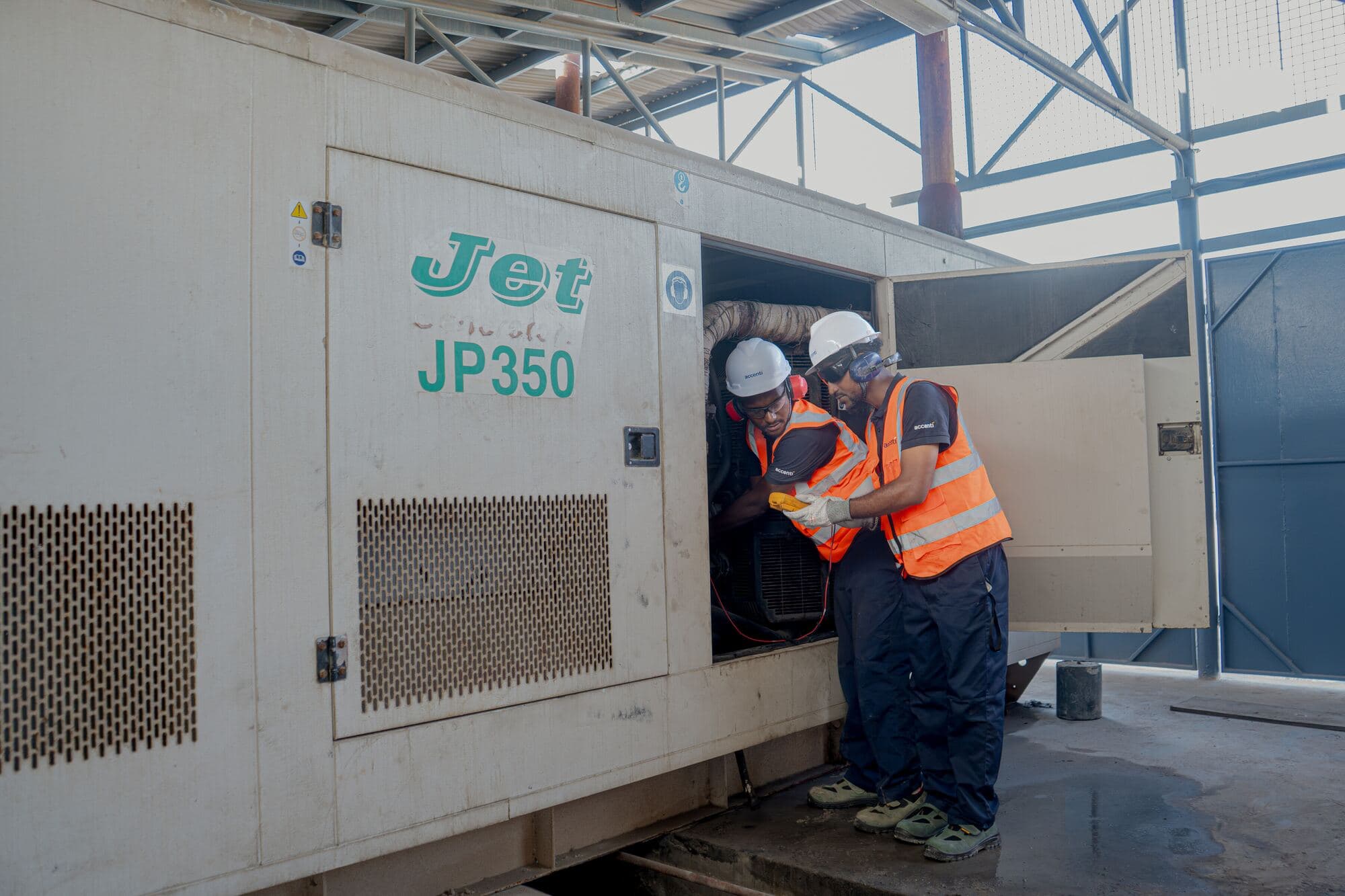 Accenti technicians servicing a power generator