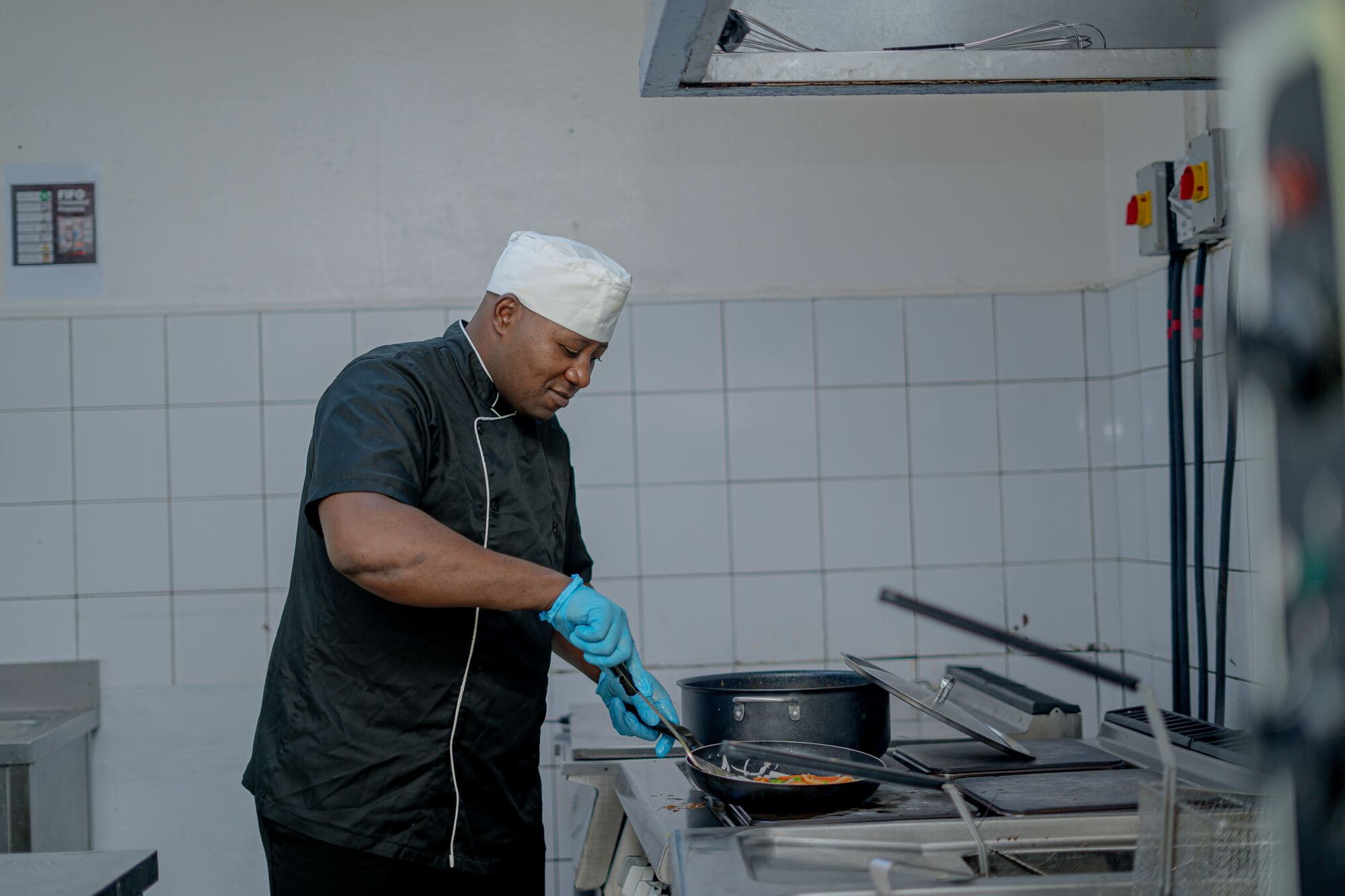 Accenti chef preparing food in a commercial kitchen