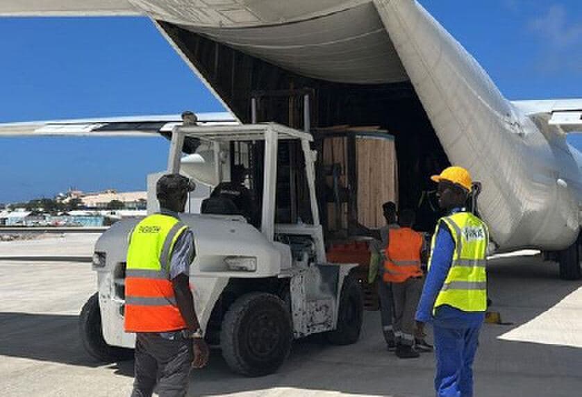 Cargo being unloaded from an aircraft by forklift