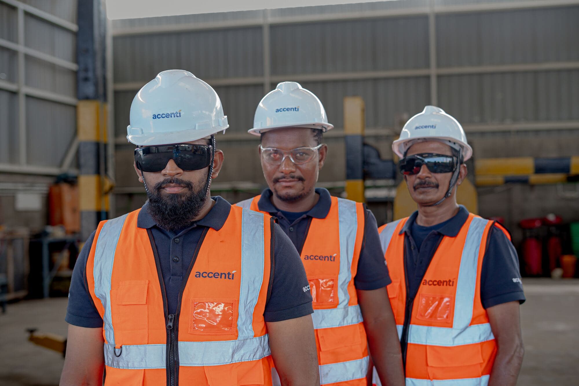 Accenti supervisors in PPE at the workshop